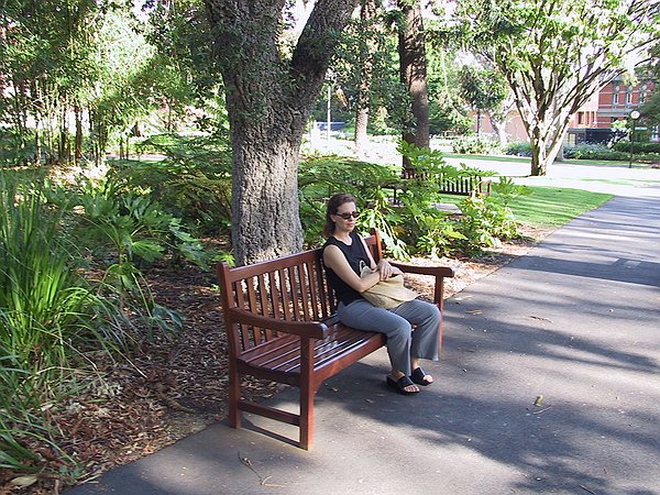 Samantha sitting in the Supreme Court Gardens in the middle of Perth.