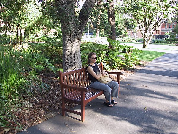 Samantha sitting in the Supreme Court Gardens in the middle of Perth.