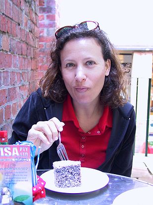 Samantha trying the delicious Australian dessert, the Lamington.
