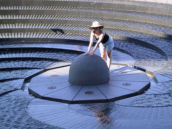 Samantha exploring a water fountain in Darling Harbour.